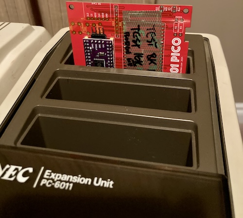 The cartridge is jammed into my PC-6011 expansion unit, to try and make it easier to debug.