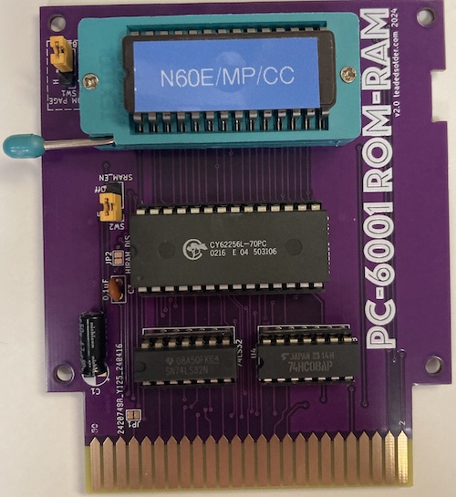 A picture of my RAM/ROM V2 cartridge, featuring a 62256 and a 256kbit 27C256 attached to it.