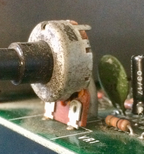 The volume potentiometer from the front. The bottom half is not just bent but broken.