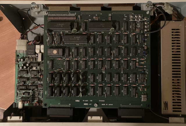The top case of the PC-8031 is removed.