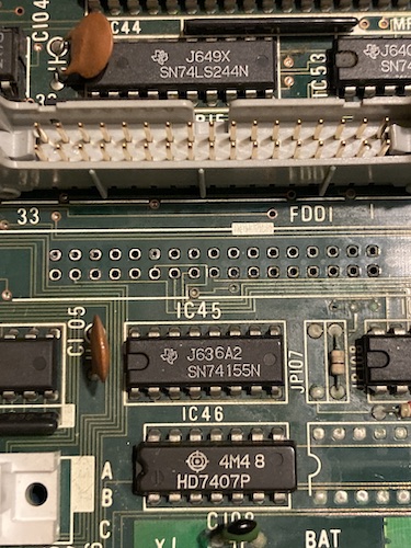 The FDD1 connector is removed, exposing the traces, vias, and through-holes underneath.