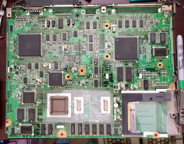 The bottom of the PC-9801NS/T board. Two large high-pin-count QFP packages can be seen near the top. The socket for installing a coprocessor is near the bottom.