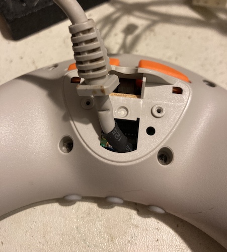 The plastic "hump" on the back of the Pippin controller is removed.