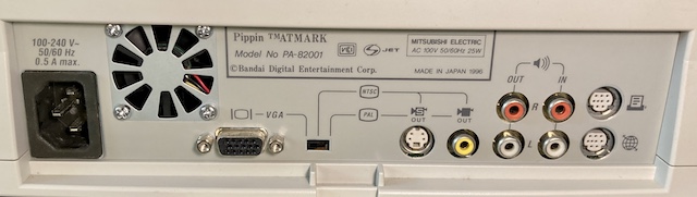 A picture of the ports on the back of my Pippin. From left to right: AC power, VGA video, a toggle switch for VGA/NTSC/PAL, S-Video out, composite video out, stereo RCA audio out/in, printer and serial/modem GeoPorts