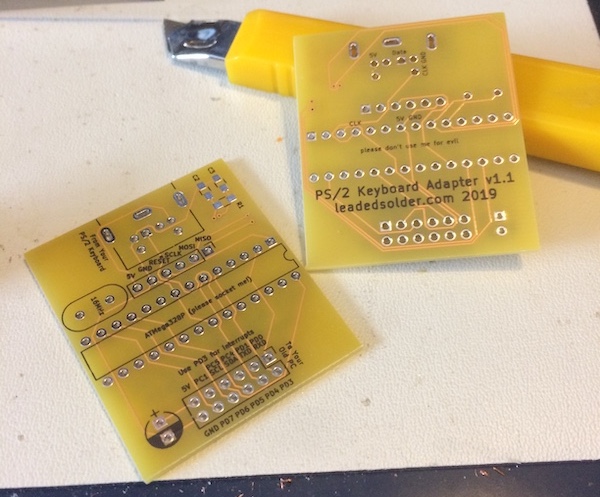 Version v1.1 of my keyboard adapter PCB, the one that we will eventually use as a hardware platform for this project. It says leadedsolder.com 2019 on the backside.