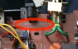 The silkscreen of the board reports HEC0470-01-230 directly underneath the power jack.