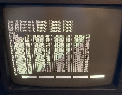 The result of dir from the CP/M command prompt. You can see a bunch of files named ROOT.DIR, F0000004.BIN, F0000004.ATR, etc