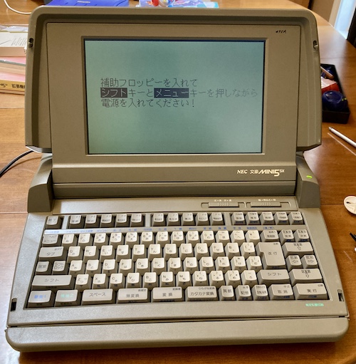 The mini5SX, running happily, displaying the boot error.