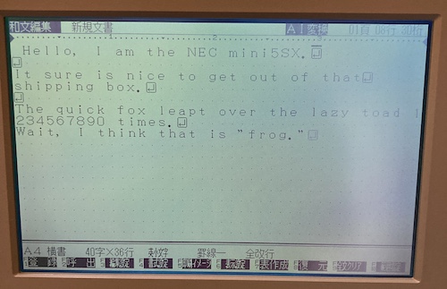 Word processing is occurring. The text reads: Hello, I am the NEC mini5SX. It sure is nice to get out of that shipping box. The quick fox leapt over the lazy toad 1234567890 times. Wait, I think that is is "frog."