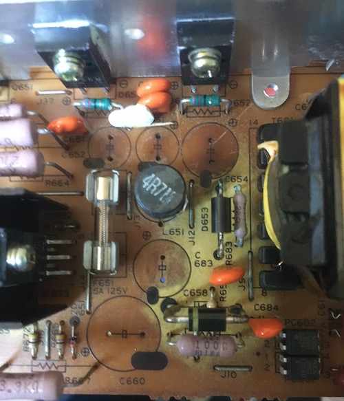 The top of the PCB substrate has lightened in colour substantially, showing how the flow of the corrosive electrolyte crept across the board.