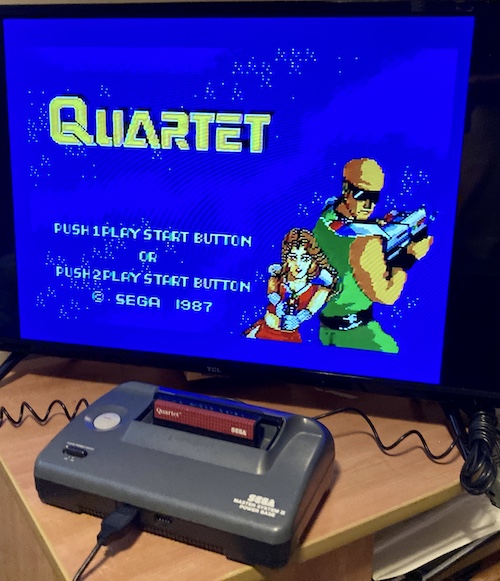 The Master System 2 is running the game "Quartet."