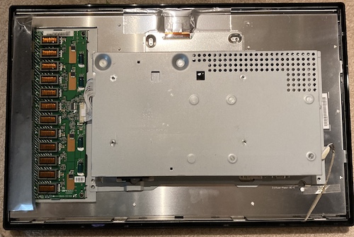 The back cover of the monitor is off, revealing... more back covers.