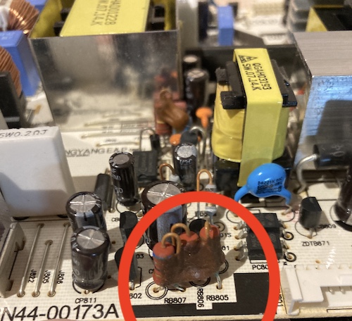These three resistors huddle together under a heat-trapping blanket of red goop. They are afraid of you.