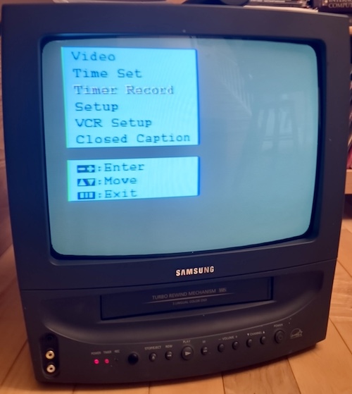 The settings menu for the set is shown. It has the options Video, Time Set, Timer Record, Setup, VCR Setup, and Closed Caption.