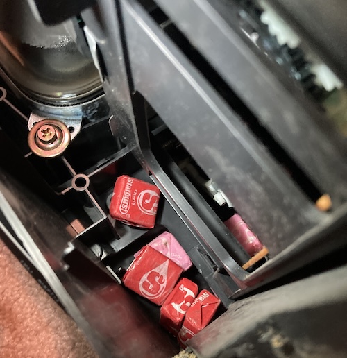 Several Starburst candies, thankfully still in the wrapper, are inside the TV.