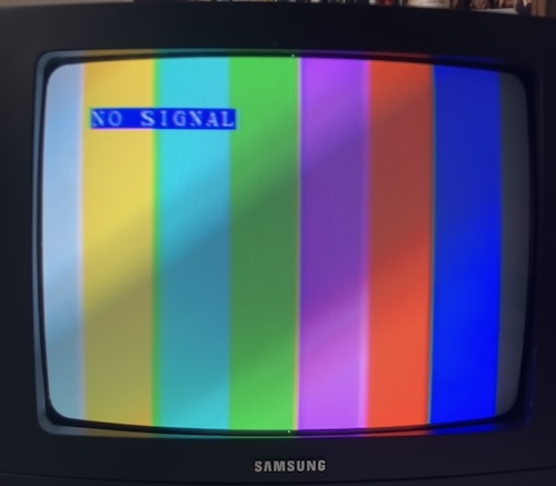 Some colour bars are shown with the message "NO SIGNAL."