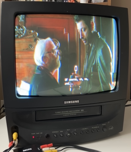 Jeff Goldblum and Richard Attenborough are having a genial disagreement.