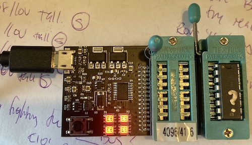 The DRAM tester is showing four red lights on a KM4164 DRAM inserted into its test socket.