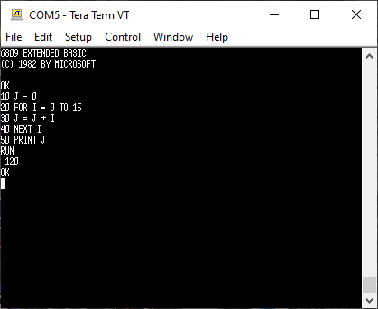 The ROM BASIC is loaded. It says 6809 Extended Basic (C) 1982 by Microsoft. OK. 10 J = 0; 20 FOR I = 0 TO 15; 30 J = J + I; 40 NEXT I; 50 PRINT J; RUN... 120. OK