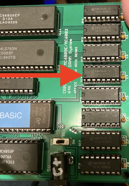 Even though all eight of the installed DRAM chips are KM4164s, one of them looks totally different, with a dot on pin 1 instead of a deep groove for the pin 1 end.