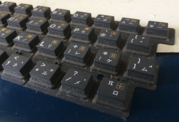 The main (black) keys have a lot of hair and dust, but little wear to the silk-screen