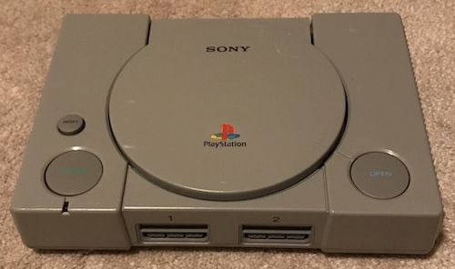 An SCPH-9001 PS1 sitting on an eBay seller's carpet, before it was shipped to me.
