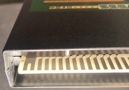 Pins B1 (labeled) and B2 are connected on the edge of this "Home Mahjong" cartridge.