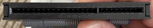 The female edge connector on the keyboard. It says "MITSUMI CINCH" near the bottom.