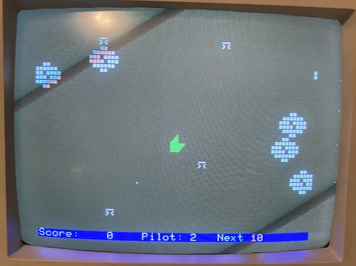 My green space ship is flying through the clouds, shooting down enemy biplanes that look like the pi symbol. Sorry about the scanlines, it is hard to fly and take pictures at the same time.
