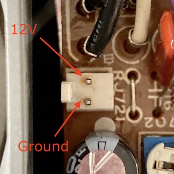 The original 2-pin fan header connector on the power supply board.