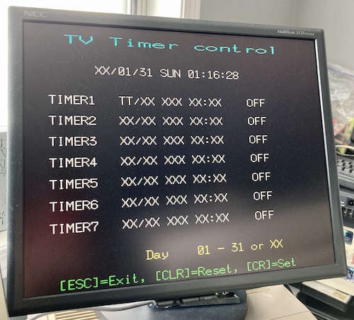 The Timer configuration screen being slowly filled with "T"s. It's like a VCR timer setup screen - there are 7 timers and you can set date and time for it to start up and set the TV channel. Since I have no battery installed, the current time is reported as XX/01/31 SUN 01:16:28.