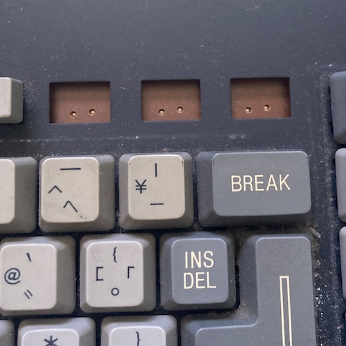 Three empty footprints for key switches are seen in the function-key row.