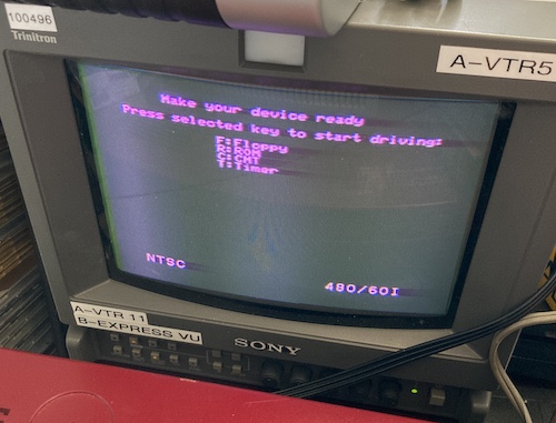 The Sharp X1 is displaying on the PVM in 480/60i. The screen reads "make ready any device" and is asking which option to attempt booting from.