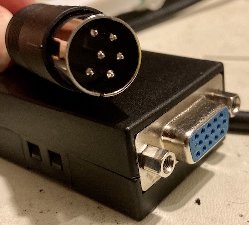 The ends of the assembled cable. You can see that the circular DIN connector shield is in two halves that are a little loose from each other.