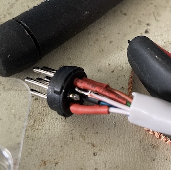 There is a loose pin and some cold-looking globs of solder.