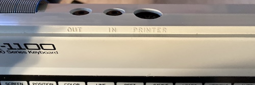 The three ports on the SK-1100: Out, In, and Printer.