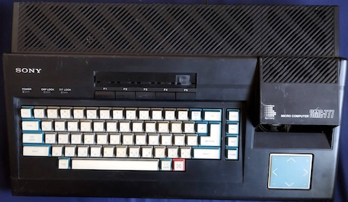 The SMC-777, in black, as it was listed on auction. There are scuffs all over the body, and the instruction card above the f-keys is missing.