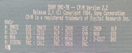 The contents of the develop disk are listed. SMATE.EXE, SMATE.HLP, ZASM.EXE, ZASM.HLP, ZDIS.EXE, ZDIS.HLP, ZDIS.SYM, MON.EXE, MON.HLP, MON4.EXE, MON4.HLP, D-EDIT.BAS, DISKRW.PAC, CALC.PAC, and VMON.PAC are all here.