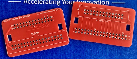 The front and back of the PCB, in red. They are basically a 26 pin male connector and a 34 pin female connector at 180 degrees to one another.