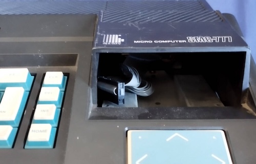 The missing floppy drive on the SMC-777. It is just an empty hole.