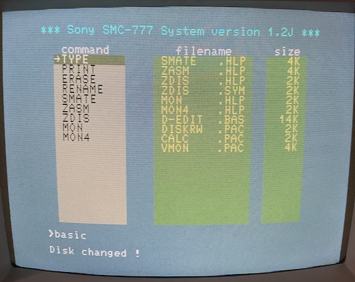 The SMC-777 Filer, now slightly curvier because it's on a CRT, claims the 'disk changed!'