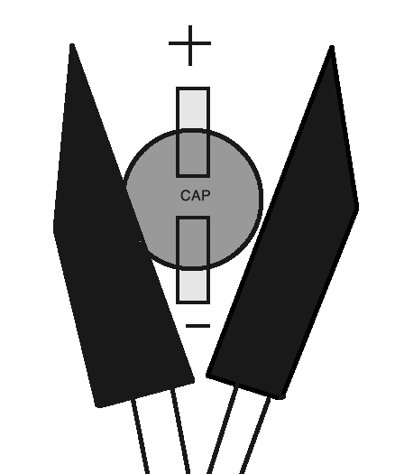 SMD cap cutting technique. The blades run the same direction as the pads, so that when the cutter is closed, it 'completes' the line made by the pads through the cap.