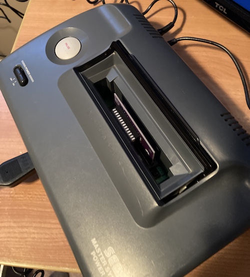 The cartridge is inserted into the Master System 2.