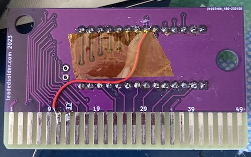 There is a red bodge wire, held with Kapton tape, from pin 11 (M0-7) to the OE pin of the ROM.