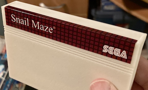 The cartridge shell now sports a snazzy "Snail Maze" sticker that looks like a factory Sega one.