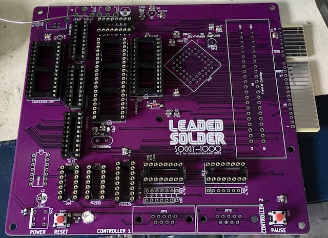 The board is partially assembled. A bunch of the sockets are stuffed, along with all the surface-mount passives.