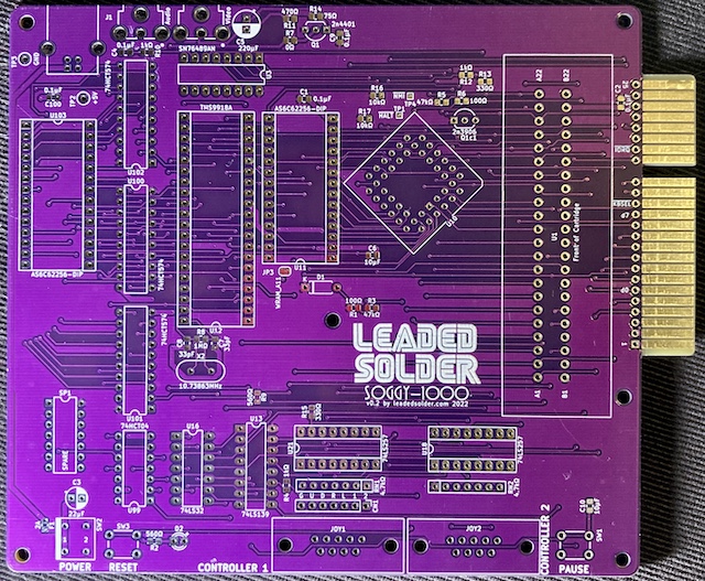The bare Soggy-1000 v0.2 board. It's extremely purple. Notice the extra test points at the top left, the additional mounting hole in the middle, and the keyboard edge on the right.