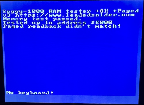 The RAM tester has failed, claiming that paged readback from $e000 failed.