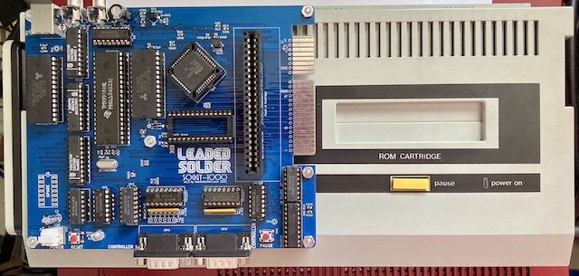 The Soggy-1000 v3 laid on top of the SG-1000 II for a size comparison. The Soggy is just a little bit over half the size.