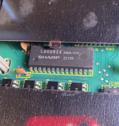 A Sharp LH0082A Z80-CTC chip sticks out of a hole in the shield.